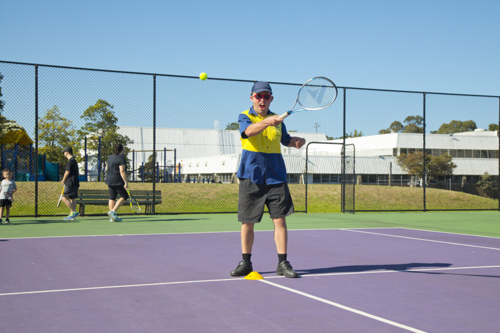 Tennis participant with tennis racquet
